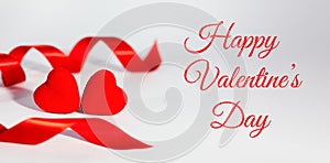 Two red hearts and red ribbon on white background. Valentine`s day card. Concept of congratulations for Valentine`s day. Banner