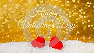 Two red hearts on white snowy background. Concept for Valentine`s day. Close-up. Banner