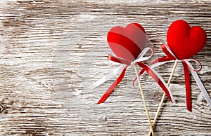 Two red hearts on wooden background. Valentines Day card.