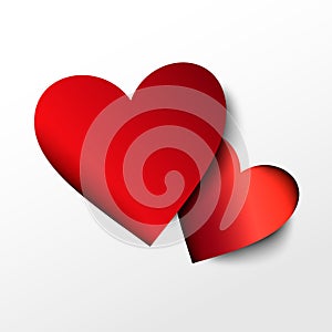 Two red paper hearts on white background