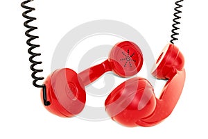 Two red phone handsets, talking concept. 3D rendering