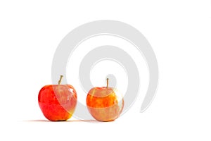 Two red ripe apples on a white background