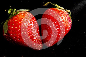 Two red small fresh sweet rope strawberry`s