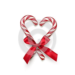 Two red striped candy cane in heart shape with red bow isolated on white background. Vector Christmas and New Year