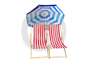 Two red striped fabric folding sling beach chairs with blue striped sun umbrella isolated on white