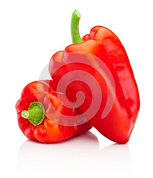 Two red sweet bell peppers isolated on white background