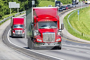 Red Semi Trucks on Highway