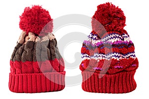 Two red winter knit ski hat isolated white