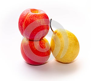 Two red-yellow apples and one pear on a white background