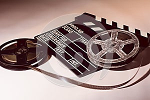 Two reels of film with a clap movie