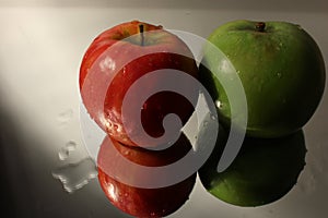 Two reflected apples & water with applying rule of thirds