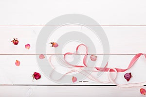 Two ribbon magic hearts on wooden backround, Valentine day concept