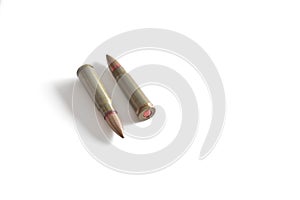 Two rifle bullets isolated on a white background. Military ammunition