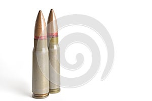 Two rifle bullets isolated on a white background. Military ammunition