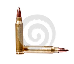 Two rifle bullets one vertical and the other horizontal isolated