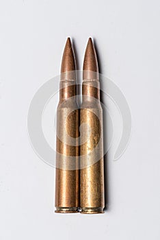 Two rifle bullets on white background