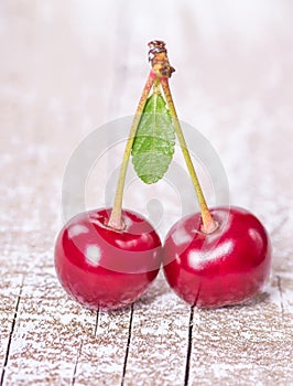 Two ripe cherries