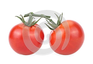 Two ripe cherry tomatoes isolated on white background. Two vegetables on branch with sepals