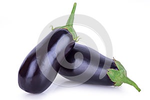 Two ripe eggplants on a white background