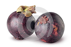 Two ripe mangosteen isolated on a white