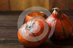 Two ripe orange pumpkins on a wooden background. Autumn fall concept. Happy Thanksgiving day. Harvest Festival. Rustic style. Copy