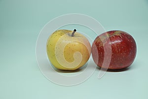 Two ripe ruddy red-yellow apple isolated on white background