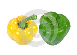 Two ripe vibrant color bell peppers, one yellow and one green with stem, isolated on white background