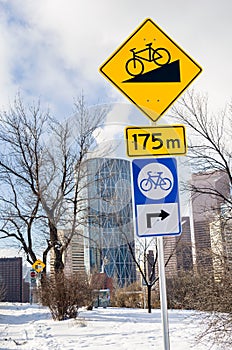 Road Signs along a Bicycle Path on a Sunny Winter Day