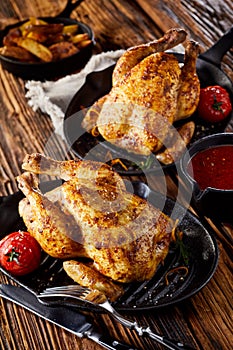 two roasted poussin or spring chickens photo