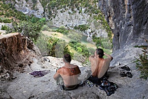 Two rock climbers having a rest