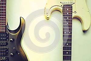 Two rock fusion funky guitars, neck fretboard on a white.Black, white, brown.