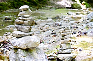 Two rock stacks in a creek bed, piles of stacked rocks