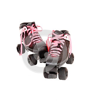 Two roller skates with black boots and pink laces