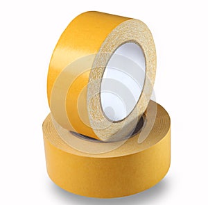 Two rolls of yellow double-sided tape on a white background, iso