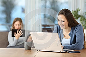 Roommates using multiple wifi devices at home photo