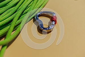 two ropes with secure knots are connected by a carabiner. Equipment for rock climbing and mountaineering. reliable connection.