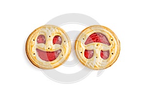 Two round biscuits smiling faces, humorous sweet food, isolated