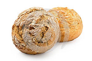 Two round rustic bread rolls isolated on white. White and whole wheat