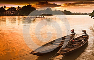 Two rowing boat boats are tied to the shore.