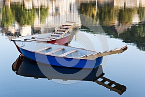 Two rowing boats moored on the river