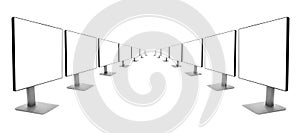 Two rows of monitors receding into the distance