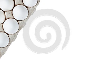 Two rows of white eggs placed in a carton isolated on a white background. Top view. Copy space.