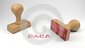 Two rubber stamps with the word DACA and a stamp on white