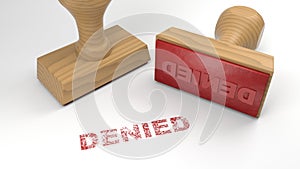 Two rubber stamps with the word denied on white rejection concept