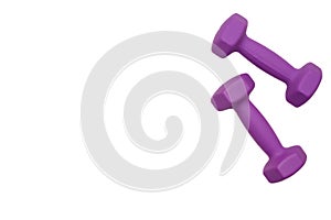 Two rubberized dumbbells 2 kg in purple color isolated on white. Sports training, fitness, sports equipment. Copy space.