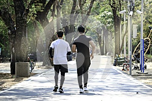Two runner men jogging in the morning  doing exercise outdoor  hansom sport male jogger athlete doing workout in garden park