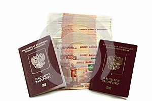 Two Russian foreign passports with large banknotes of face value of five thousand rubles. Travel and tourism