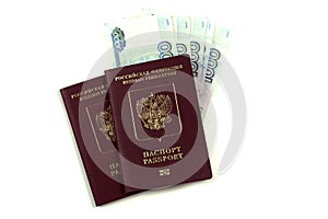 Two Russian passports with a pack of one thousand rubles. The concept of immigration, tourism, travel to the resort. Purchase or