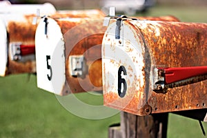 Two rusty mailboxes