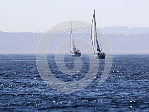 Two Sailboats on Deep Blue Water